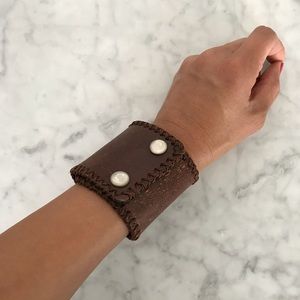 Brown band bracelet with adjustable snap closure